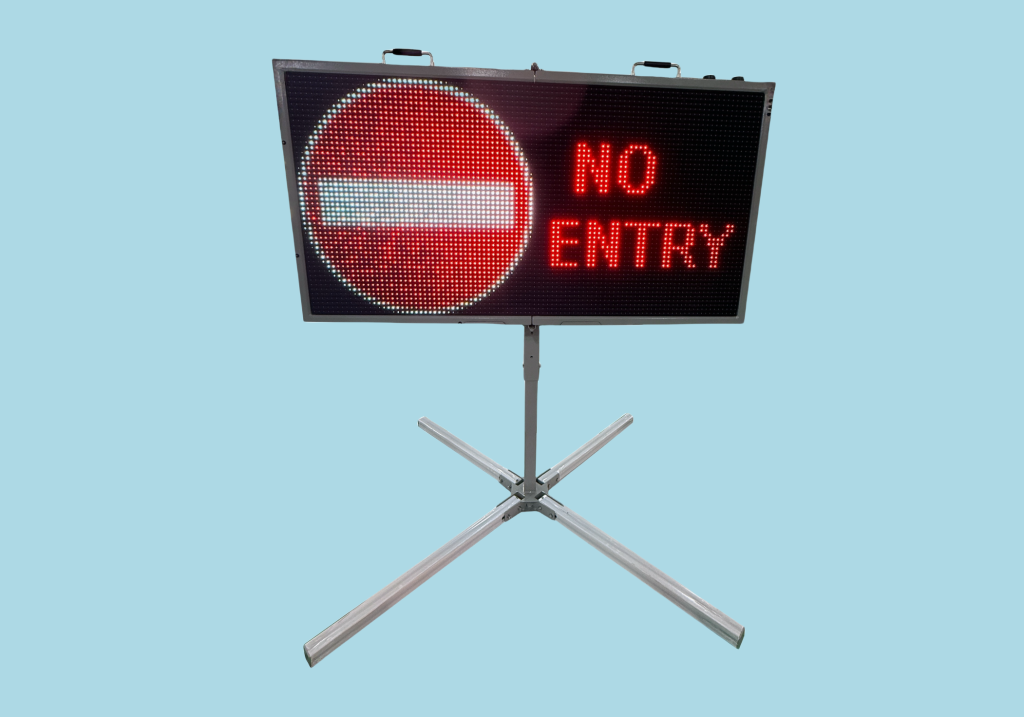 Portable Variable Message Sign on a stand displaying a red 'No Entry' symbol and text.